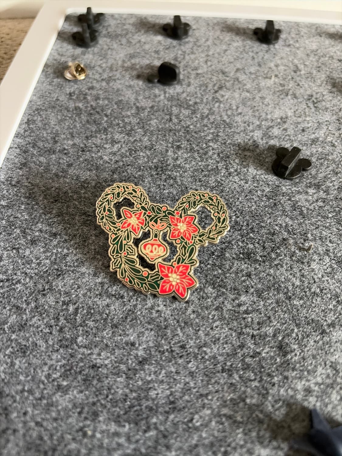 Disney Parks 2024 Mickey Head Poinsettia Wreath Pin front