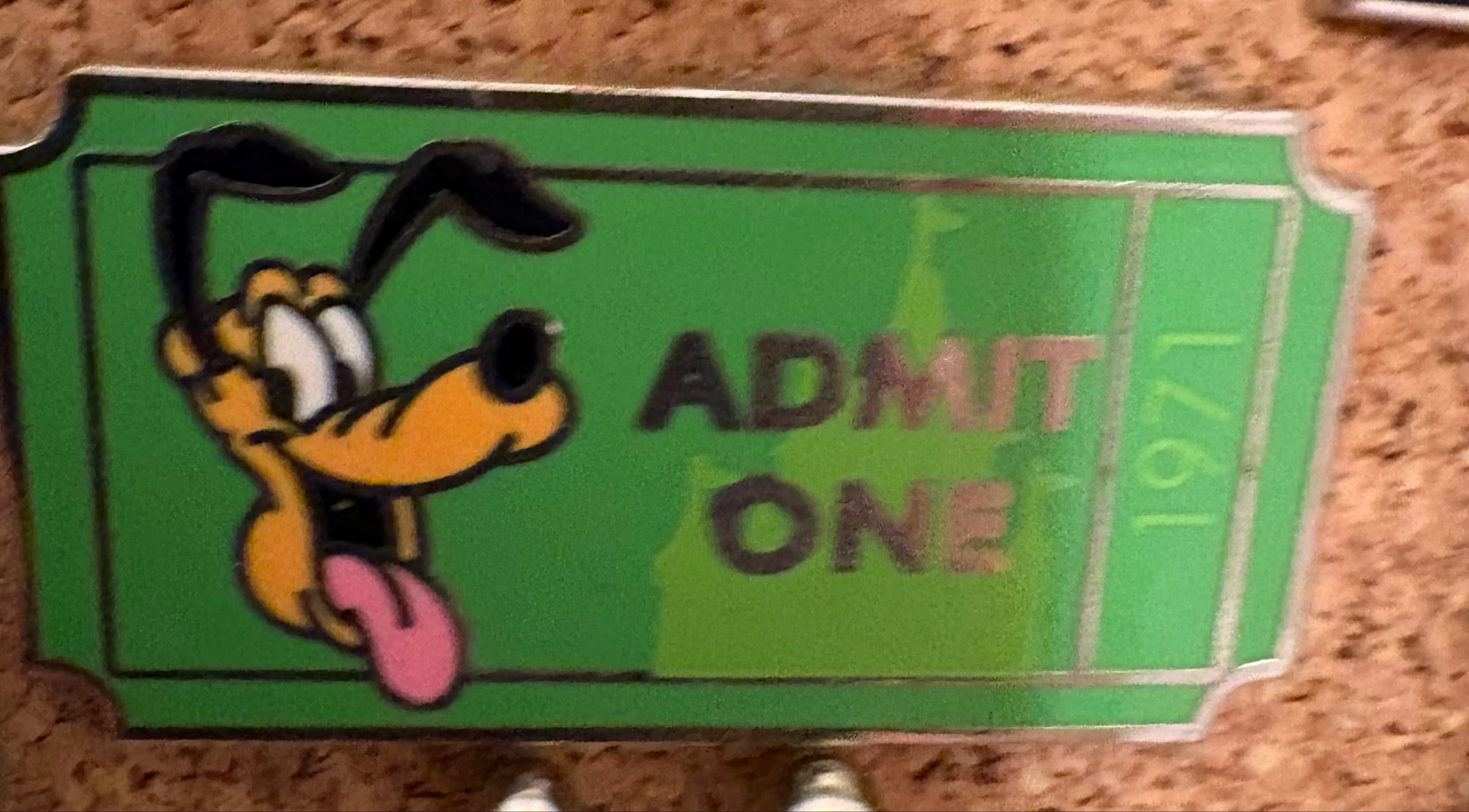 Pluto Admit One Ticket 1971 Pin front