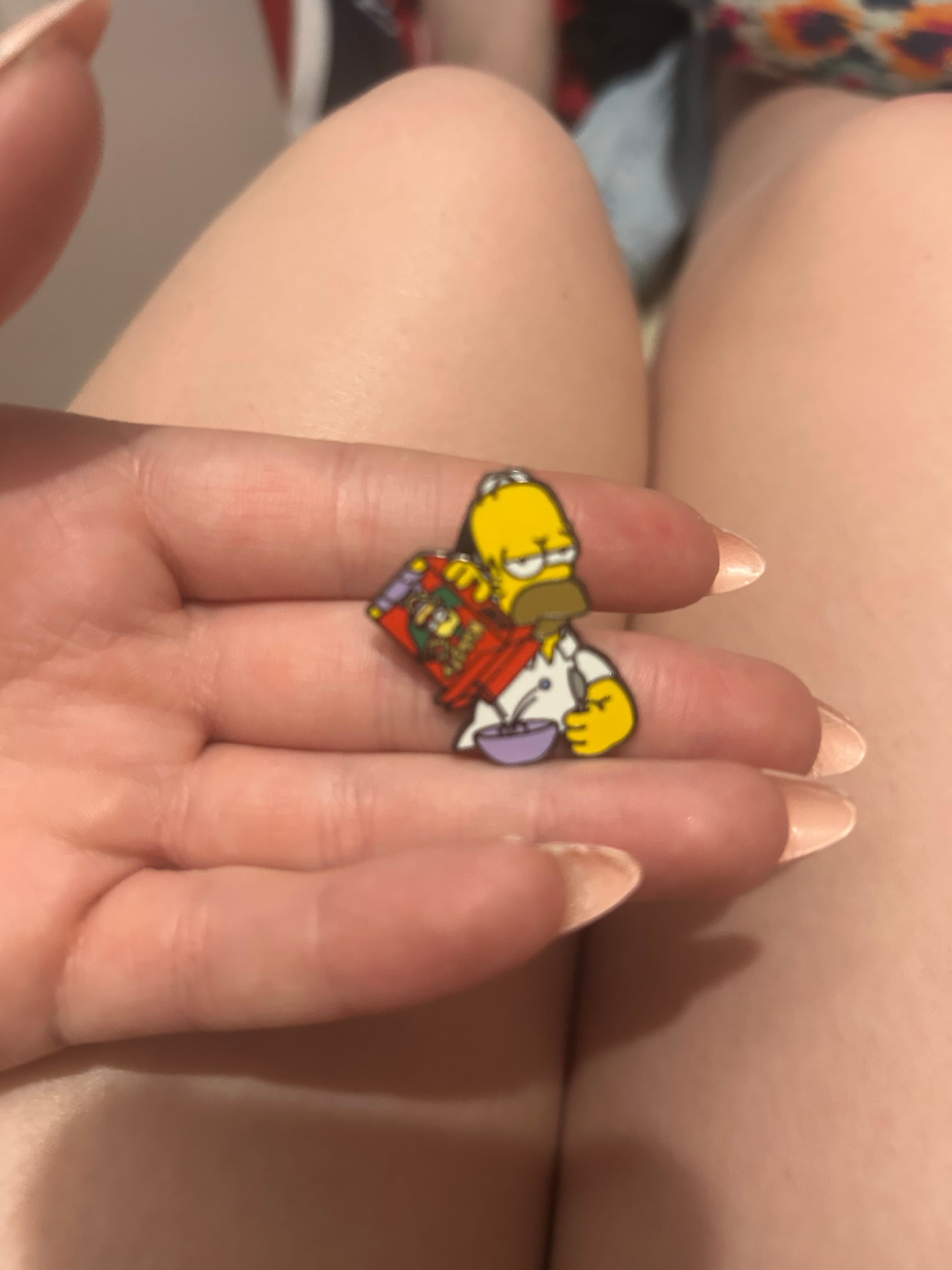 Homer Simpson Pouring Cereal Enamel Pin front