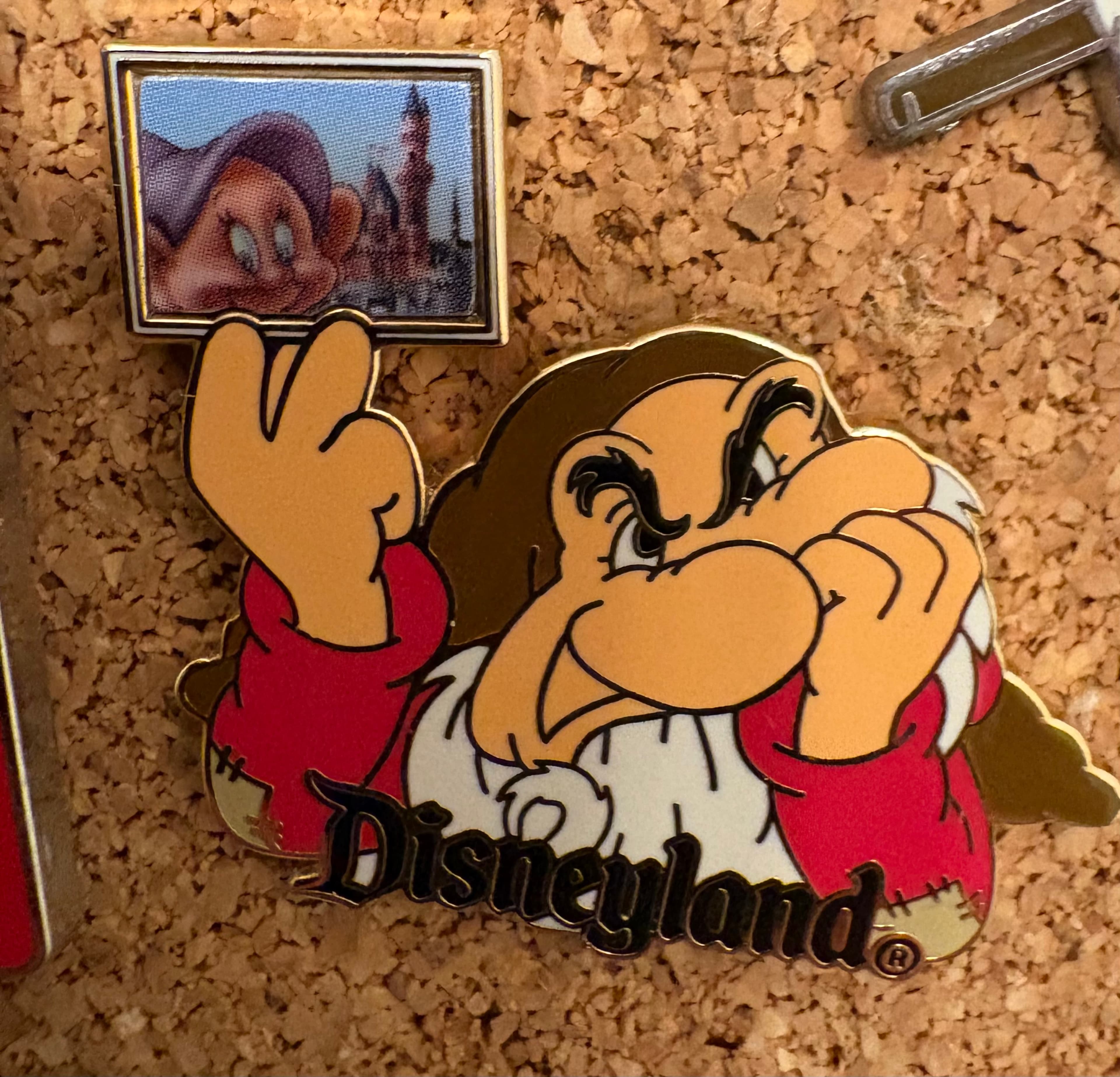 Grumpy Holding Photo of Dopey - Disneyland