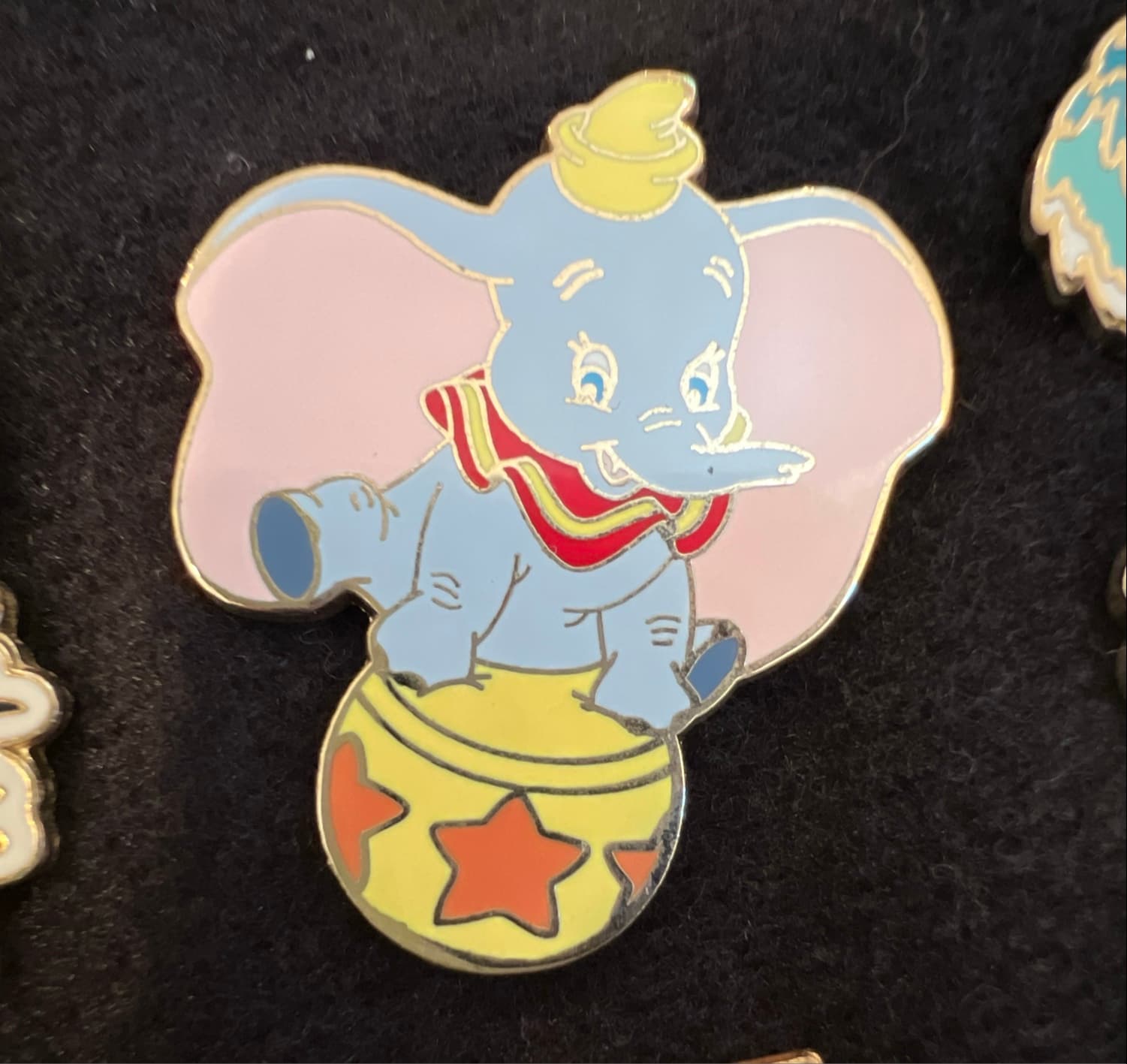 Dumbo Sitting on a Yellow Circus Ball front