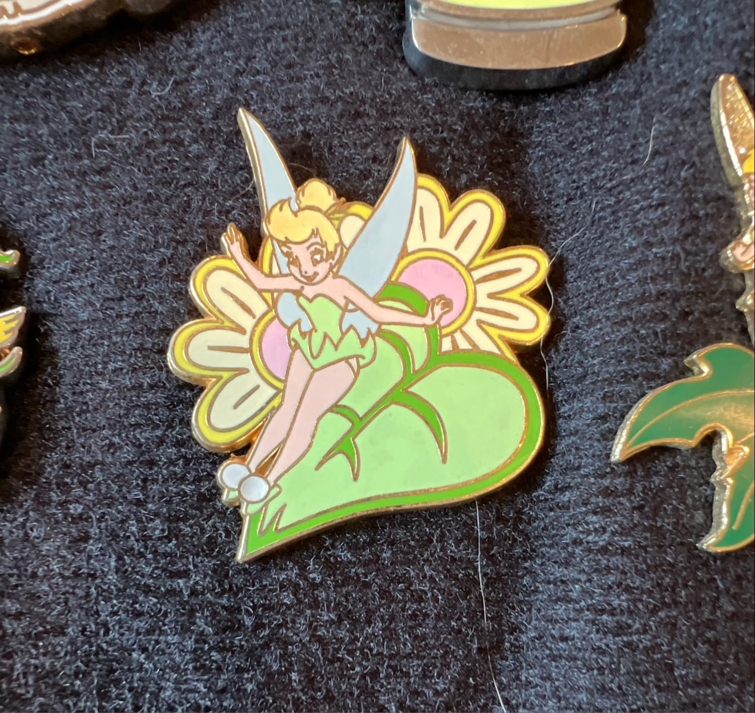 Tinker Bell Sitting on the Leaf of a Pink Flower