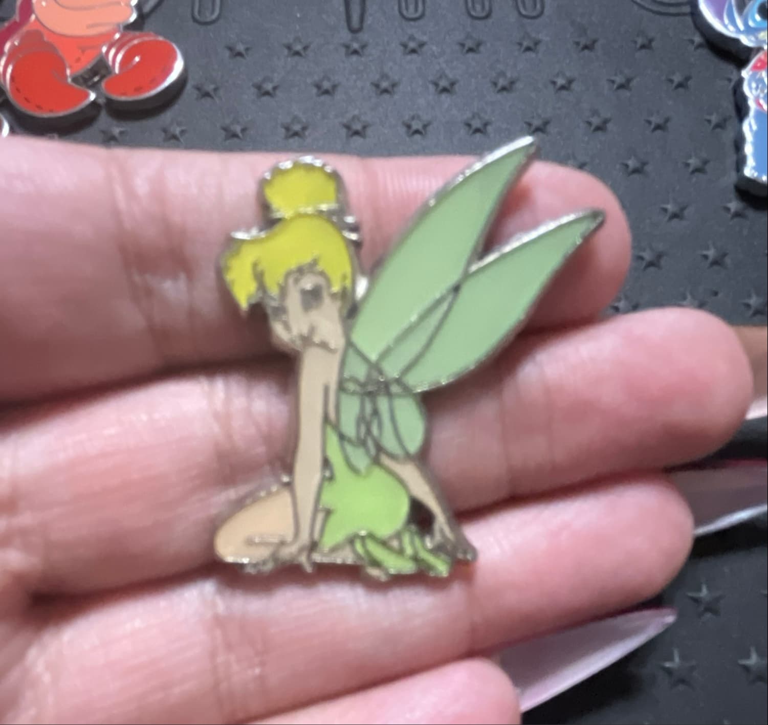 Tinker Bell Sitting Looking Over Shoulder