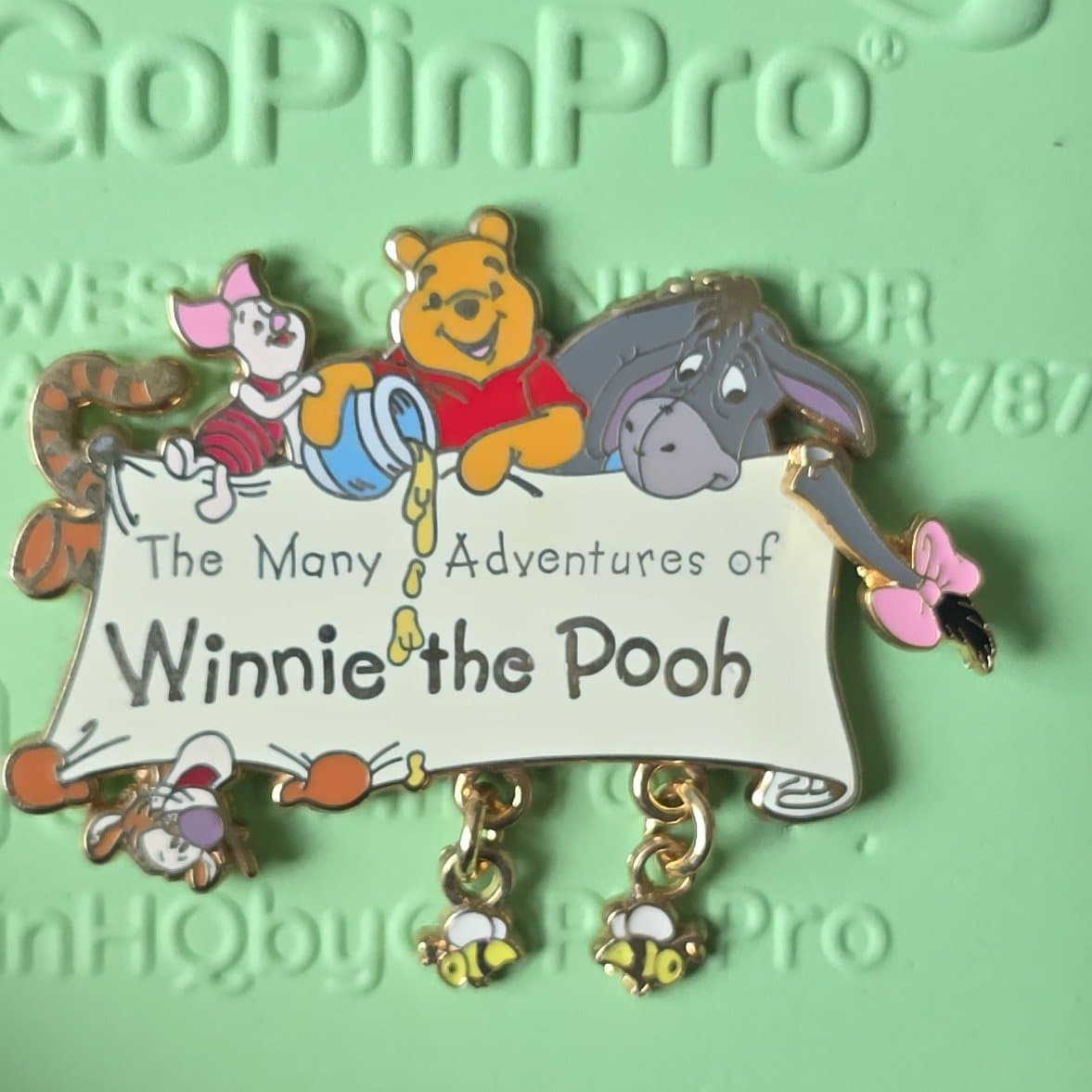 The Many Adventures of Winnie the Pooh Dangle Logo with Bees