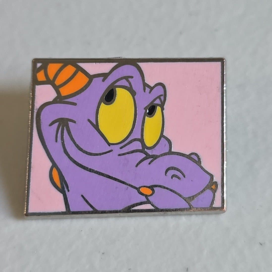 Figment smiling pink background front