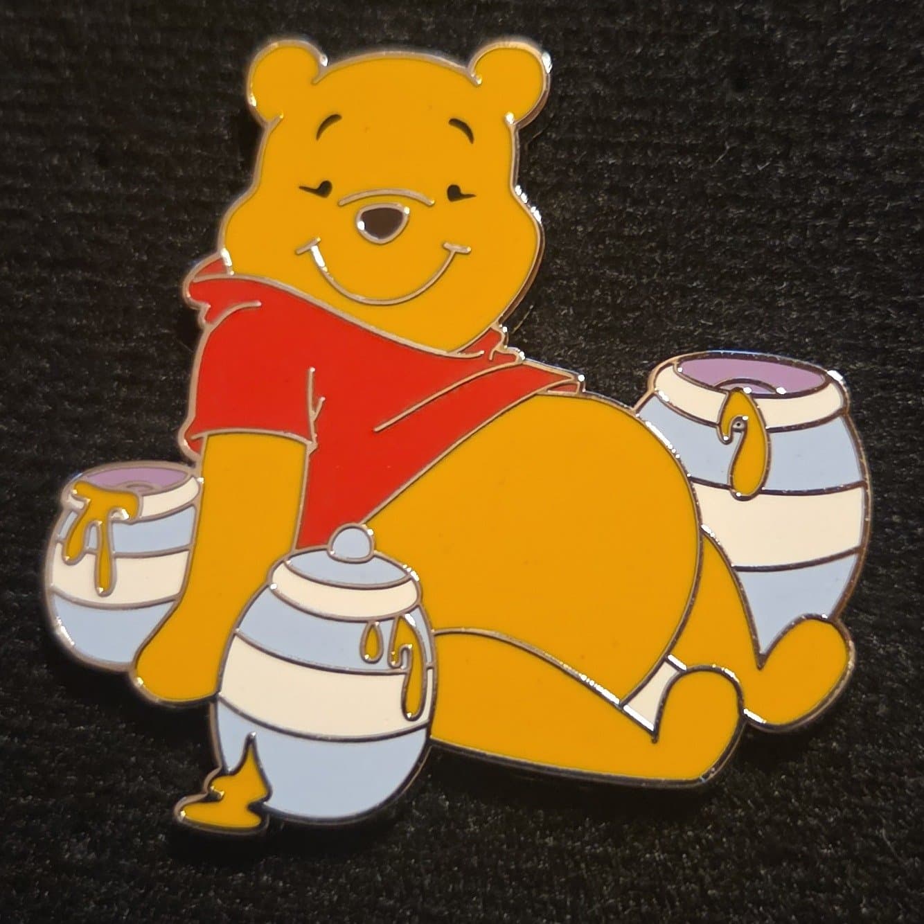 Winnie the Pooh - Pooh Sitting with Hunny Pots front