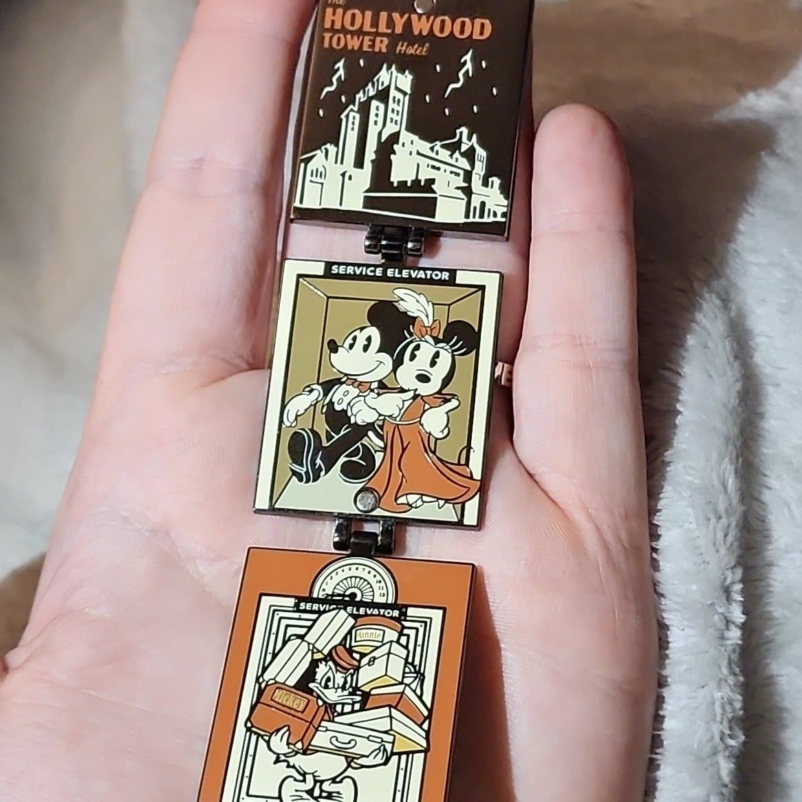 The Hollywood Tower Hotel Fold Out Pin with Mickey, Minnie, and Donald front