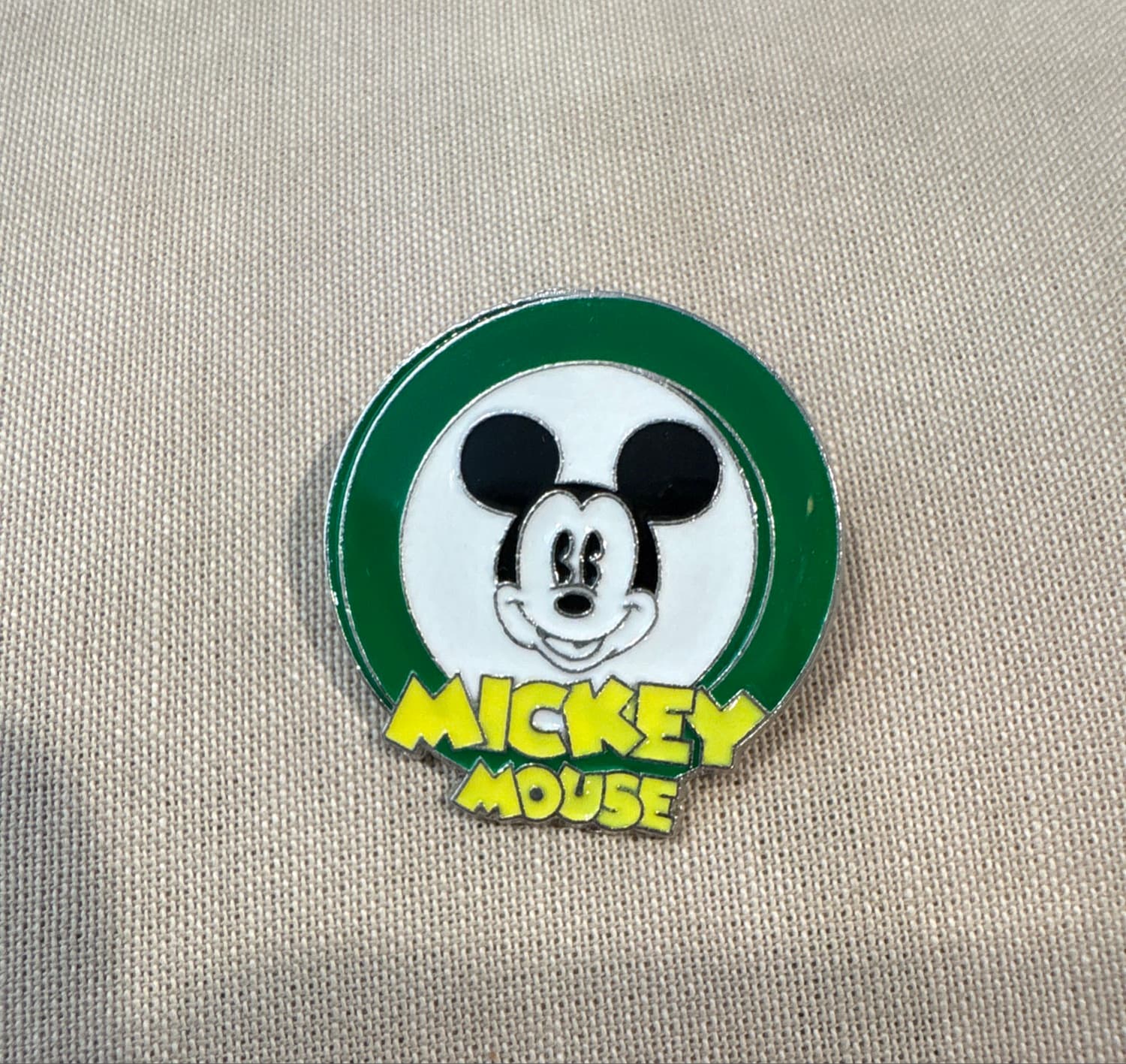 Mickey Mouse Head Green Circle Yellow Text front