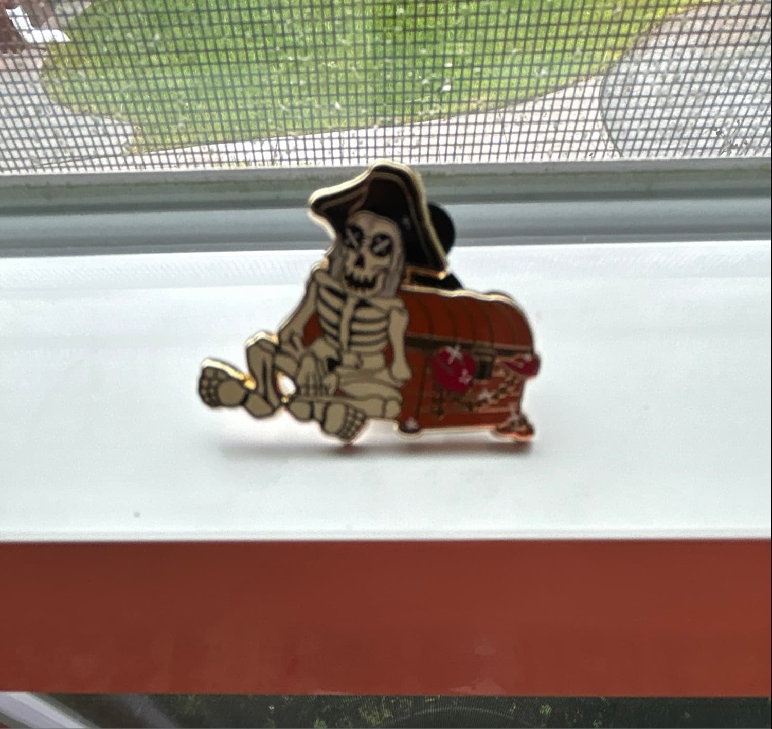 Pirate Skeleton Sitting on Gold Chest