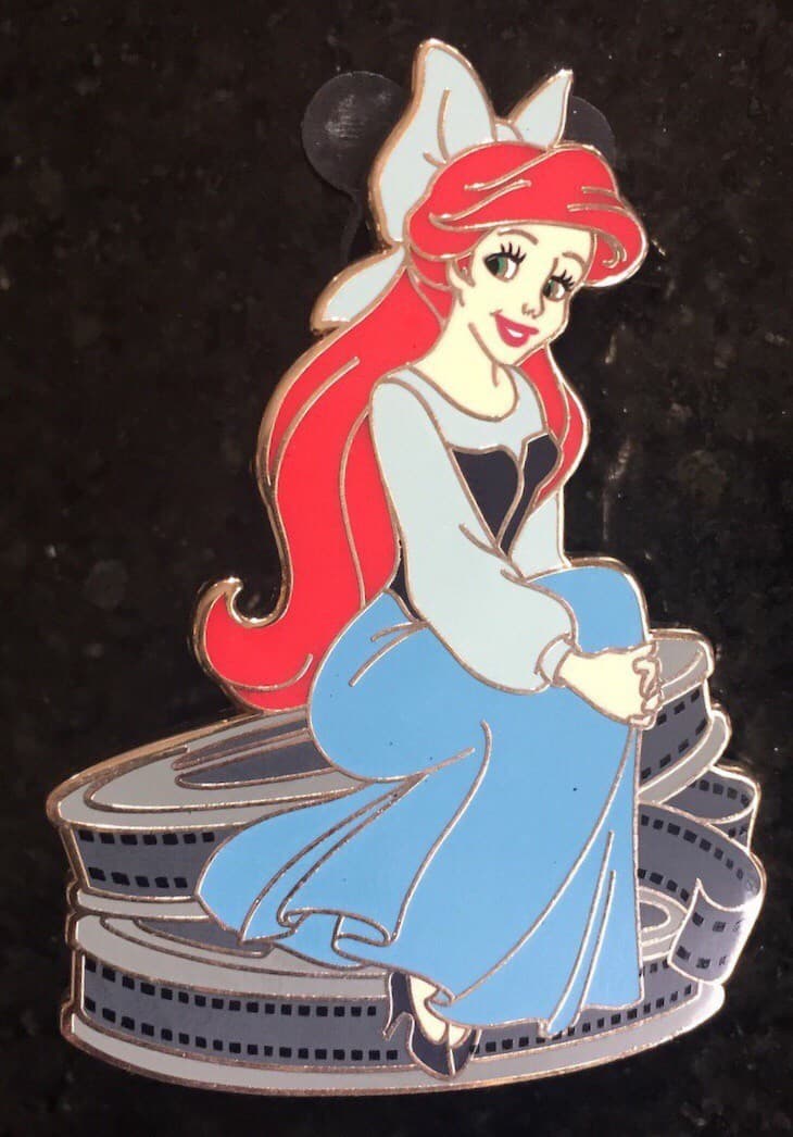 Ariel Sitting on Movie Reels